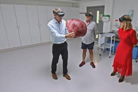 Adrian, Dr Nick Burfitt and Kate Garraway looking at an enlarged prostate GFX in studio