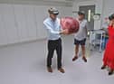 Adrian, Dr Nick Burfitt and Kate Garraway looking at an enlarged prostate GFX in studio