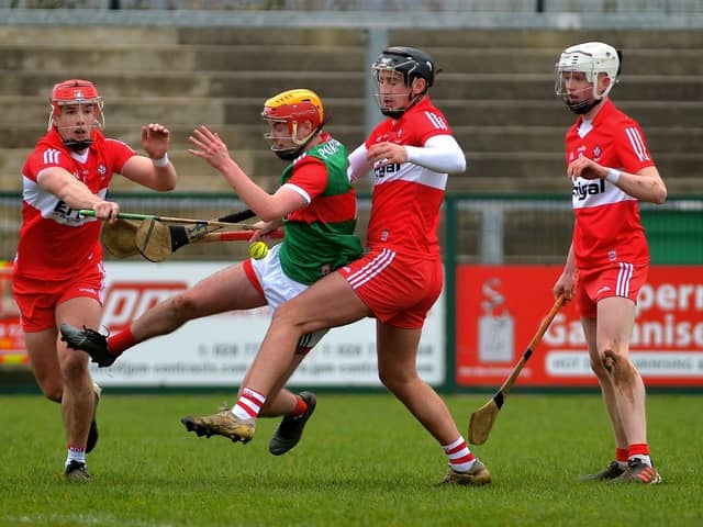 Derry ‘s John Mullan and Meehaul McGrath battle for possession with Mayo’s Conor Murray at Owenbeg last Sunday. Photo: George Sweeney. DER2209GS – 003