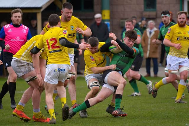 City of Derry’s Ross McLaughlin fights off a chasing Bruff pack at Judges Road on Saturday afternoon last. Photo: George Sweeney. DER2208GS – 113