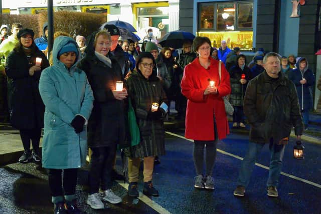People gather in Market Square in Buncrana on Thursday  evening last for prayers and a candle-lit vigil in solidarity with the people of Ukraine.  Photo: George Sweeney.  DER2209GS – 052