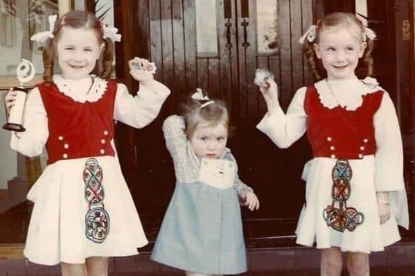Margaret Keys, pictured left, was also an Irish dancer for a period as a child. Her twin sister Rosemary is pictured on the right and her sister Tina is in the middle.