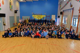 St Patrick’s PS Pennyburn P 6 and 7 staff and pupils pictured with Steelstown Brian Og’s players and coaches during a visit to the school on Friday morning last. Photo: George Sweeney.  DER2208GS – 084