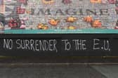 2019: Graffiti relating to Brexit at a peace Wall in Belfast. Photo Colm Lenaghan/Pacemaker Press