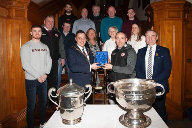 The Mayor of Derry City and Strabane District Council, Graham Warke makes a special presentation to Brian Dooher, manager of the2021 All Ireland winning Tyrone team during a reception in the Guildhall on Monday night. On Brian’s left is Ciaran McLaughlin, Ulster GAA President, and included are senior players, club representatives, family members and elected representatives.