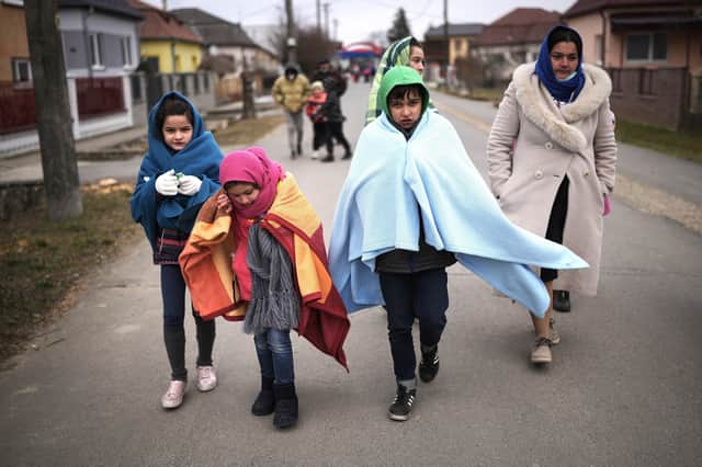 Refugees flee the conflict in Ukraine.