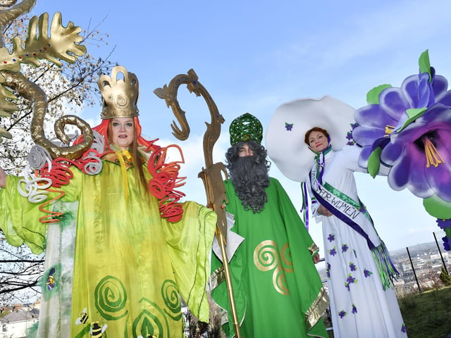 Stilt walkers Audrey Doherty (Brigid), Michael Johnston (St. Patrick) and Sorcha Shanaghan (Suffragette) getting ready for the annual St. Patrick's Day parade. DER1118-129KM