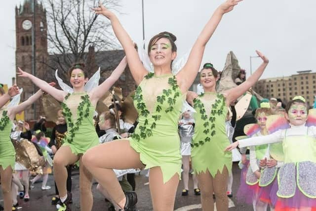 Dancers make their way past the Guildhall during Derry City and Strabane District Council’s the annual Spring Carnival on St. Patrick’s Day in Derry-Londonderry. Picture Martin McKeown. Inpresspics.com. 17.03.17