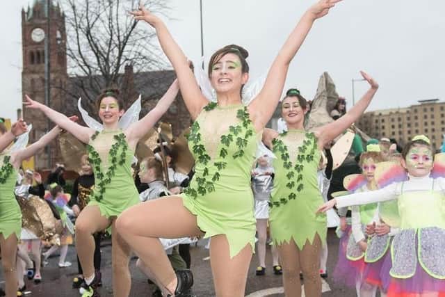 Dancers make their way past the Guildhall during Derry City and Strabane District Council’s the annual Spring Carnival on St. Patrick’s Day in Derry-Londonderry. Picture Martin McKeown. Inpresspics.com. 17.03.17