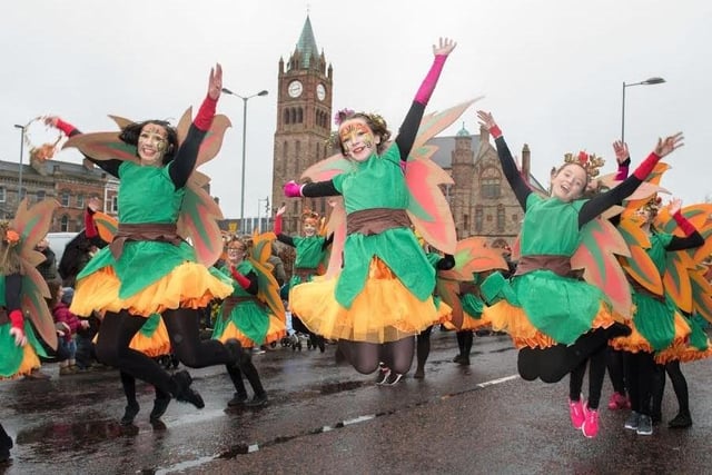 Dancers from St. Cecilia's College leap in the air as they make their way past the Guildhall during Derry City and Strabane District Council’s the annual Spring Carnival on St. Patrick’s Day in Derry-Londonderry. Picture Martin McKeown. Inpresspics.com. 17.03.17