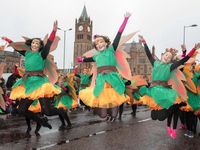Dancers from St. Cecilia's College leap in the air as they make their way past the Guildhall during Derry City and Strabane District Council’s the annual Spring Carnival on St. Patrick’s Day in Derry-Londonderry. Picture Martin McKeown. Inpresspics.com. 17.03.17