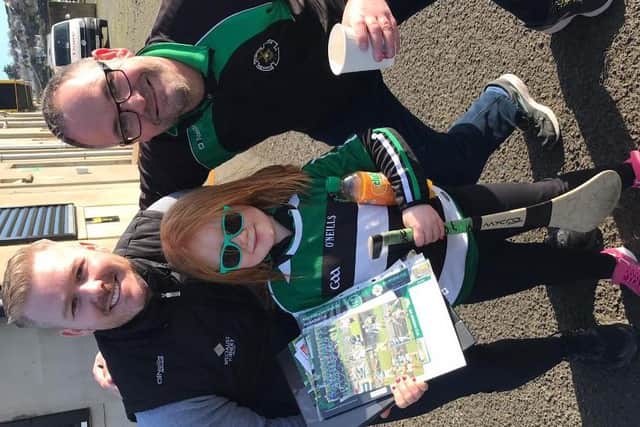 Na Magha Under 7 star Laoise Ni Mhianain pictured selling tickets at last week’s Derry v Donegal National League match in O’Donnell, Park, Letterkenny with Diarmuid Shiels and Gearalt O Mianain.