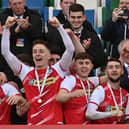 Cliftonville's Ryan Curran, Paul O'Neill and Jamie McDonagh celebrate as captain Chris Curran lifts the Bet McLean League Cup aloft. Picture by Colm Lenaghan/Pacemaker