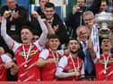 Cliftonville's Ryan Curran, Paul O'Neill and Jamie McDonagh celebrate as captain Chris Curran lifts the Bet McLean League Cup aloft. Picture by Colm Lenaghan/Pacemaker