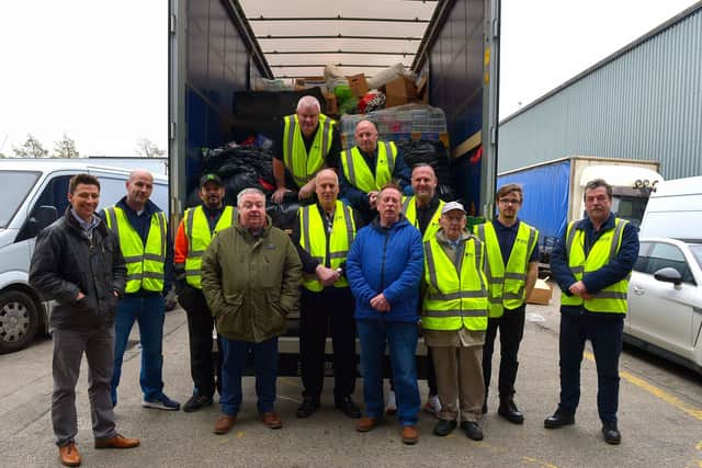 Terry Quigley, proprietor B-Fast transport, on the right, who provided a lorry and trailer for the transportation of local donations of medical supplies, food and clothing to the Ukraine pictured with drivers Sean Breen and Daniel Allen, volunteers and Colrs. Ryan McCready, Darren Guy and Philip McKinney at the B-Fast premises in Campsie on Tuesday morning last. Photo: George Sweeney.  DER2211GS – 018