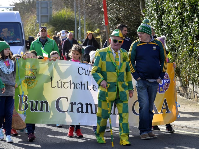 John Porter leads the Buncrana GAA representation at the St Patrick’s Day parade. DER1219GS-025