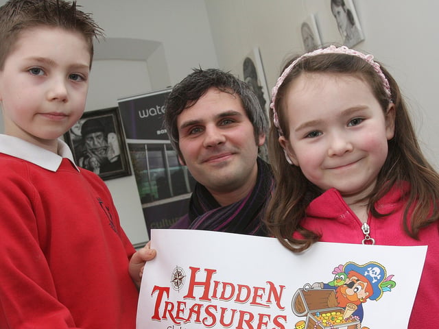 Eight-year-old Lisnagelvin Primary School pupil Jake Miller, winner of the Waterside Theatre ‘Hidden Treasure, Design a Logo’, competition with his ‘Captain Jake’, design, pictured with his sister Jessica and theatre graphic designer Warren Barr. INLS 0411-501MT.