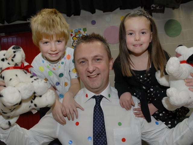 Colin Torrens, Principal, pictured with pupils Matthew and Courtney who took part in the 'Show Your Spots' day held at Lisnagelvin Primary School on Friday to raise money for BBC Children in Need. INLS4710-168KM