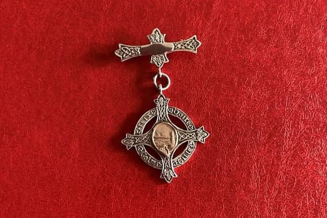 An original Derry Feis medal from 1922.