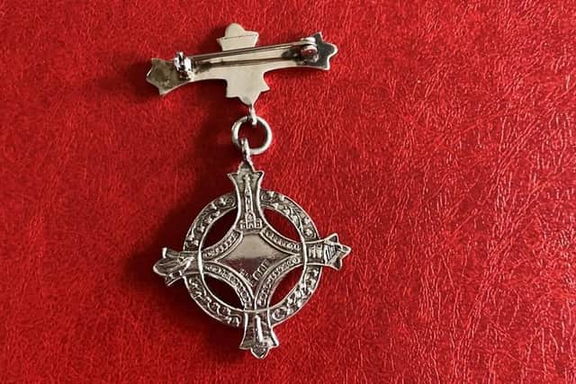 The reverse side of the original medals were as intricately designed as the front and every image on them is highly symbolic.