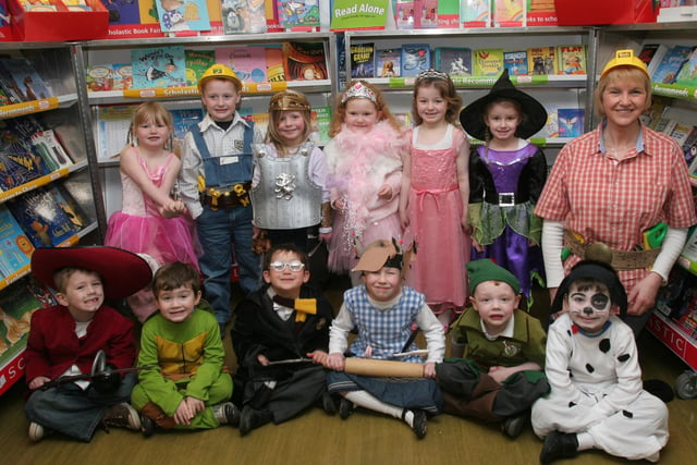 Alison Dougherty, teacher, with pupils from P1, dressed in characters from story books for the storytelling day at Lisnagelvin primary school, organised as part of the school's 'Book Day' event. (2802T03).
