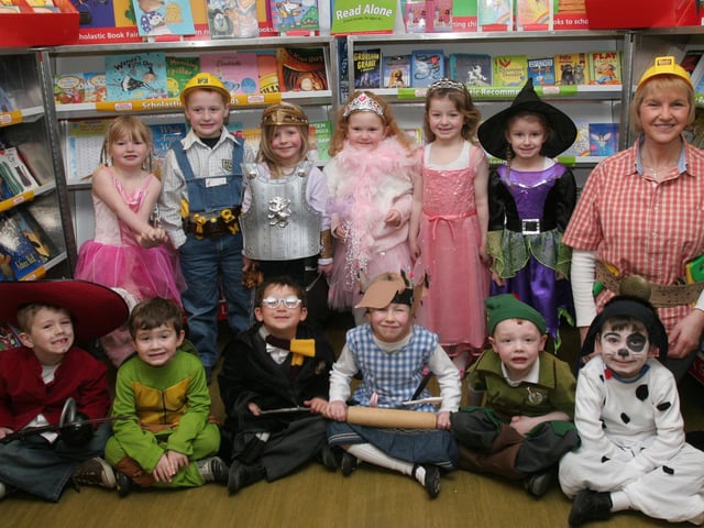 Alison Dougherty, teacher, with pupils from P1, dressed in characters from story books for the storytelling day at Lisnagelvin primary school, organised as part of the school's 'Book Day' event. (2802T03).