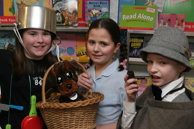Dressed in character from story books are pupils (from left), Sarah McKittrick, as 'Saucepan Man', Aimee Peoples, as Dorothy from The Wizard of Oz, and Nathan Tennis, as Sherlock Holmes,  at the storytelling day at Lisnagelvin primary school, organised as part of the school's 'Book Day' event. (2802T06).