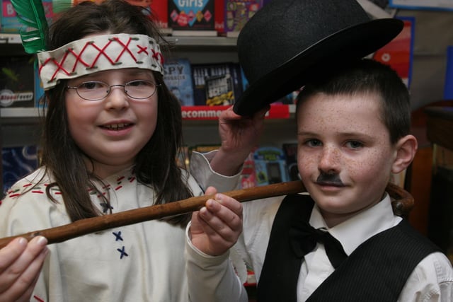 Dressed in character from story books are pupils Chloe Black, as 'Pochantas' and Jordon McMullan, as Charlie Chaplan, at the storytelling day at Lisnagelvin primary school, organised as part of the school's 'Book Day' event. (2802T07).