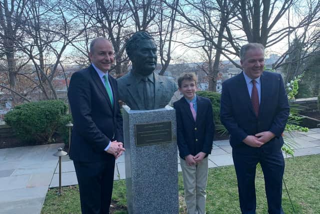 The Taoiseach Micheál Martin with Aidan and Daragh Hume at the unveiling of a new bust in honour of the late John Hume in Washington D.C.
