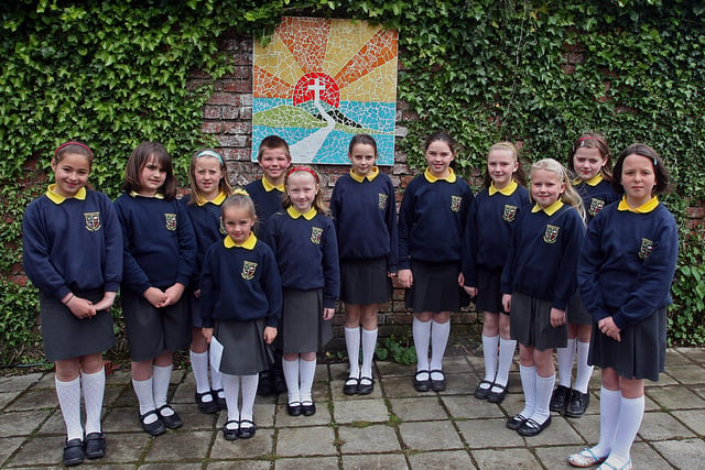 Pupils from Ebrington primary school, attending the official opening of the  'Quiet Garden',  at See House, Culmore, beside one of the many mosaic murals  surrounding the garden which the children along with pupils from Steelstown, Lisnagelvin and St.Paul's Slievemore, primary schools, helped to create for the occasion. LS21-535MT.