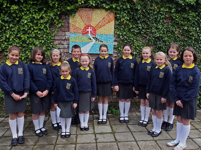 Pupils from Ebrington primary school, attending the official opening of the  'Quiet Garden',  at See House, Culmore, beside one of the many mosaic murals  surrounding the garden which the children along with pupils from Steelstown, Lisnagelvin and St.Paul's Slievemore, primary schools, helped to create for the occasion. LS21-535MT.