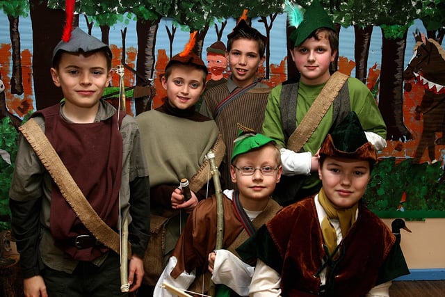 Aaron Feathers (seated, right) as ‘Robin Hood’, in the school play ‘Hoodwinked’, put on by pupils at Lisnagelvin Primary School, with his ’Merrymen’, from left, Ryan Hepburn, Kyle Duncan, Andrew Stevenson, Joel Boxborough (Will Scarlett) and Dakota Lewis (Little John).  LS13-517MT.