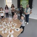 Jeanette pictured with some of the young people and their artwork during Thursdayâ€TMs St. Patrickâ€TMs Day celebrations at the Cathedral Youth Club. (Photos: Jim McCafferty Photography)
