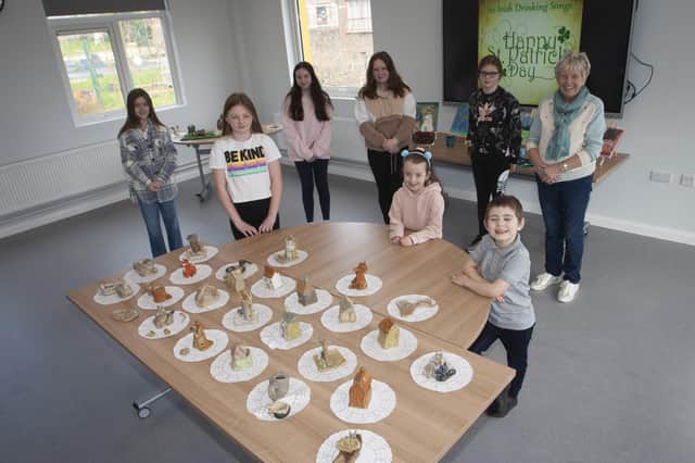 Jeanette pictured with some of the young people and their artwork during Thursdayâ€TMs St. Patrickâ€TMs Day celebrations at the Cathedral Youth Club. (Photos: Jim McCafferty Photography)
