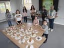 Jeanette pictured with some of the young people and their artwork during Thursdayâ€TMs St. Patrickâ€TMs Day celebrations at the Cathedral Youth Club. (Photos: Jim McCafferty Photography)