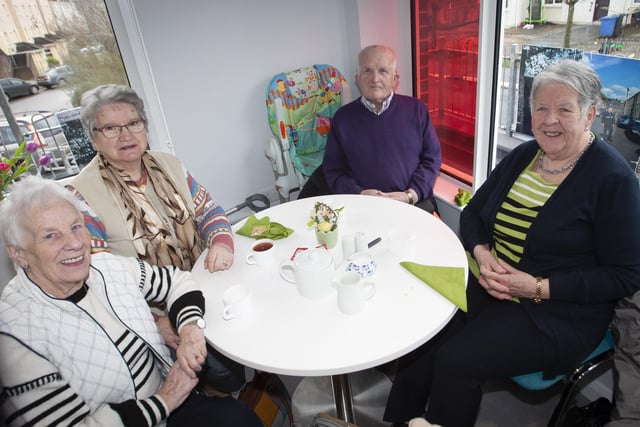 Relaxing over a coffee are Harriot Devenney, Betty Dunn, Lily Lindsay and George Lindsay.