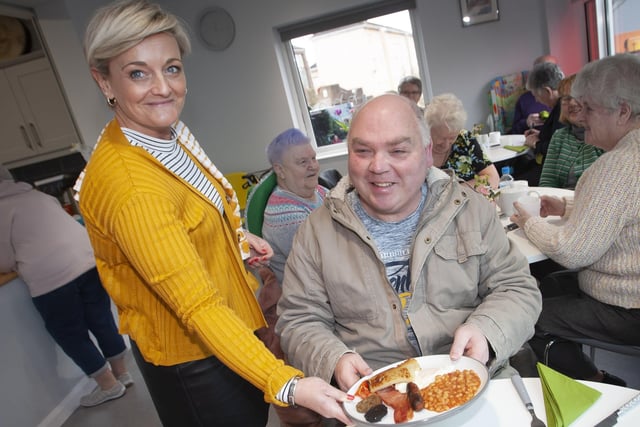 SERVICE WITH A SMILE. . . . .Charlene Metcalfe serving up one of the famous fries to Trevor Camphill during Thursdayâ€TMs St. Patrickâ€TMs Day celebrations in the Cathedral Youth Club.