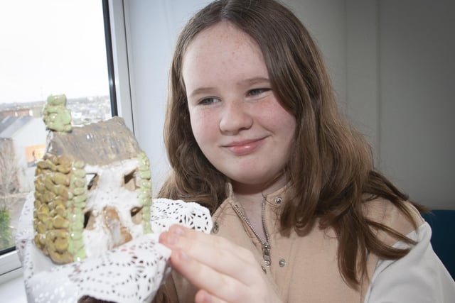 Young Leah Hetherington with a pieace of her artwork on Thursday.
