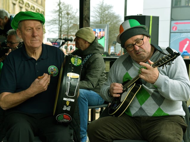 Traditional musicians play in Waterloo Place during the St Patrick’s Day celebrations in the city. Photo: George Sweeney / Derry Journal. DER2211GS – 091