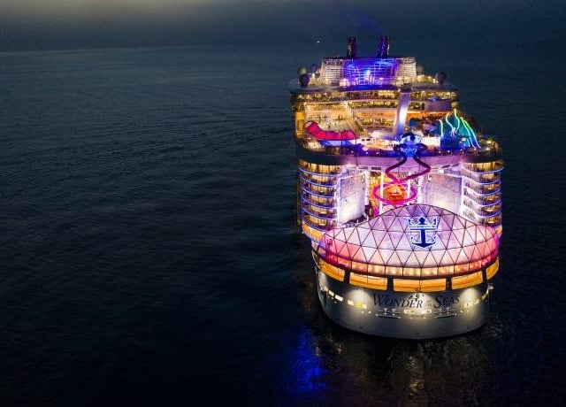 Wonder of the Seas at night.