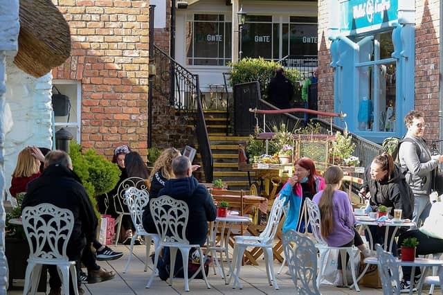 People relax in the Cottage Cafe in the Craft Village. Photo: George Sweeney / Derry Journal. DER2117GS 045