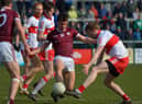Derry’s Brendan Rogers closes in on Galway’s Sean Kelly at Owenbeg on Sunday afternoon last. Photo: George Sweeney. DER2212GS – 006