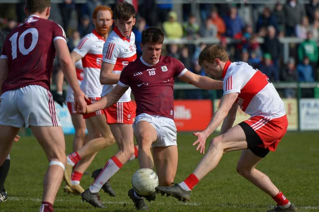 Derry’s Brendan Rogers closes in on Galway’s Sean Kelly at Owenbeg on Sunday afternoon last. Photo: George Sweeney. DER2212GS – 006