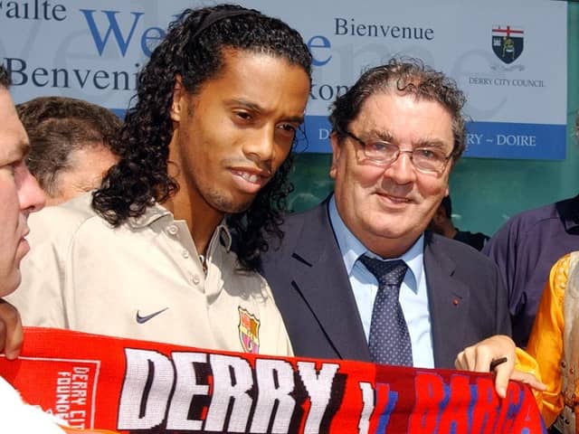 Ronaldinho pictured alongside the late great John Hume holding a Derry City/Barcelona half and half scarf in 2003.