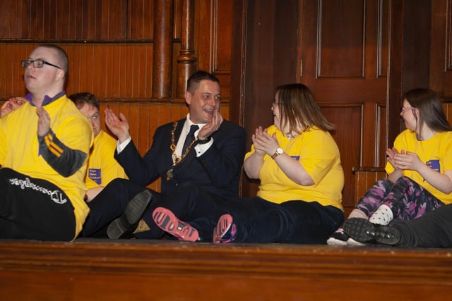 Mayor Warke enjoying the craic with members of the Foyle Down Syndrome Trust team on stage at the Guildhall on Monday.