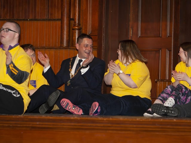 Mayor Warke enjoying the craic with members of the Foyle Down Syndrome Trust team on stage at the Guildhall on Monday.