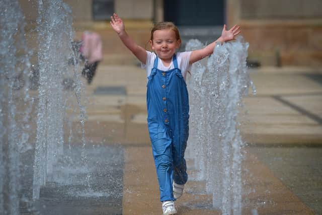 Young Millie Flinham running through the water fountains in Guildhall Square back in 2020. DER2033SG – 002