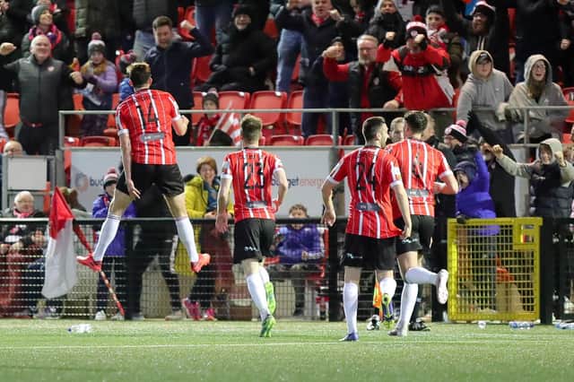 Will Patching jumps for joy in front of the Derry City supporters at the Ryan McBride Brandywell Stadium after scoring his late winner against St Pat's. Photograph by Kevin Moore.