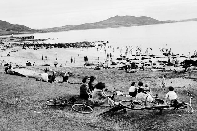 1957... Relaxing on the shorefront at Buncrana with Inch Island in the background.