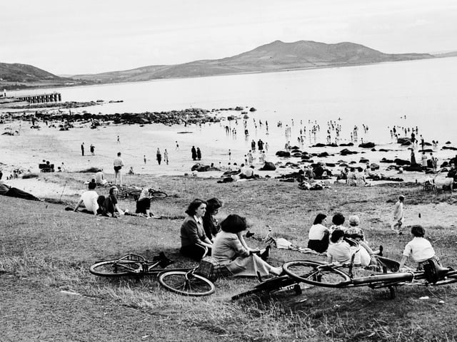 1957... Relaxing on the shorefront at Buncrana with Inch Island in the background.